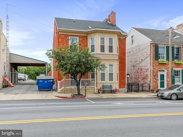 25 E Potomac St, Williamsport, MD 21795 - view of property featuring brick siding and a chimney