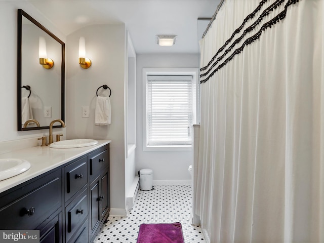25 E Potomac St, Williamsport, MD 21795 - bathroom with double vanity, baseboards, and toilet
