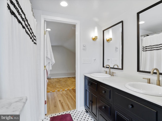 25 E Potomac St, Williamsport, MD 21795 - full bathroom featuring double vanity, lofted ceiling, recessed lighting, and baseboards