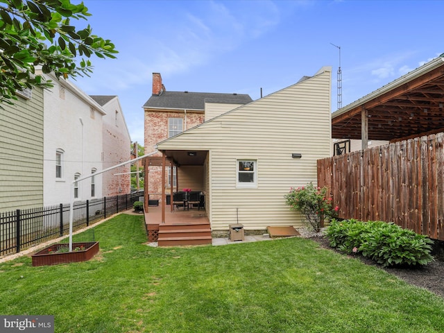 25 E Potomac St, Williamsport, MD 21795 - rear view of property featuring a deck and a chimney