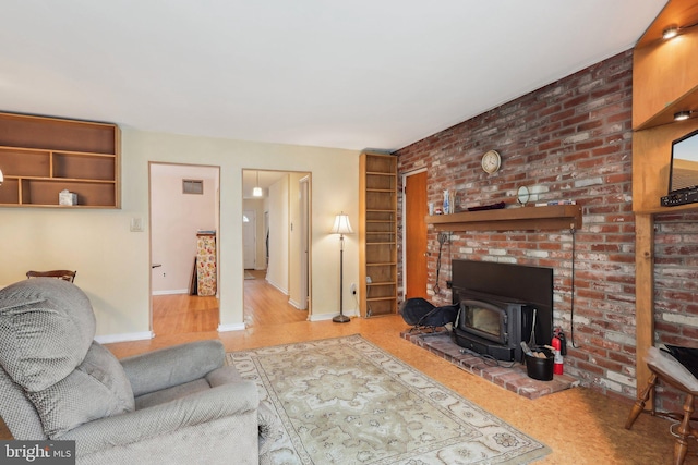 140 Ardmore Ave, Haddonfield, NJ 08033 - living area featuring a wood stove, baseboards, and wood finished floors