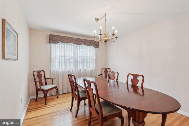 140 Ardmore Ave, Haddonfield, NJ 08033 - dining space featuring a chandelier, light wood-type flooring, and baseboards
