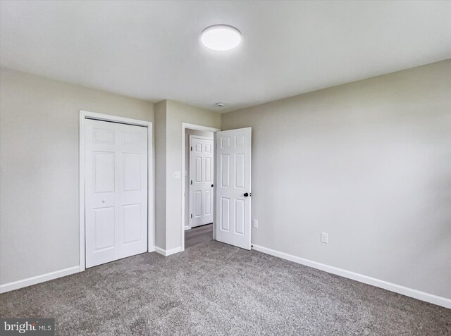 6985 Old Harrisburg Rd, York Springs, PA 17372 - unfurnished bedroom with carpet, baseboards, and a closet