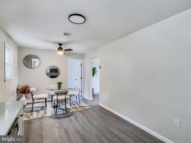 6985 Old Harrisburg Rd, York Springs, PA 17372 - dining space featuring dark wood finished floors, a ceiling fan, and baseboards