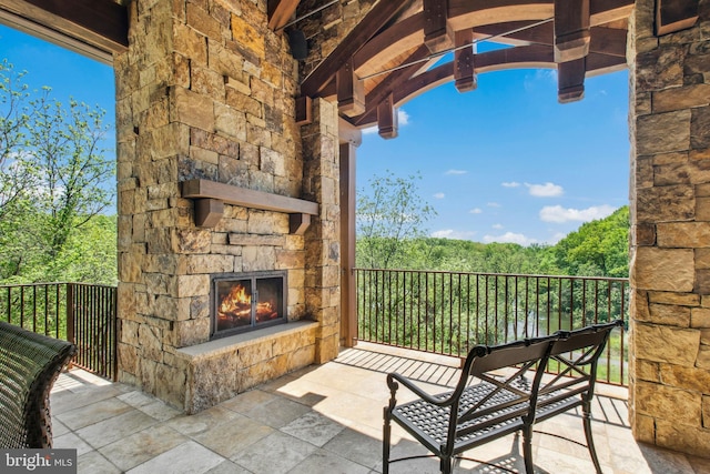 2042 Folk Rd, Fogelsville, PA 18051 - balcony featuring an outdoor stone fireplace and a forest view