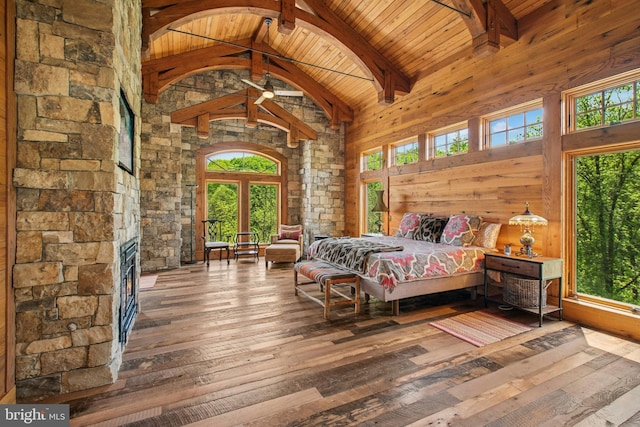 2042 Folk Rd, Fogelsville, PA 18051 - bedroom with wooden ceiling with exposed beams, hardwood / wood-style floors, multiple windows, wood walls, and high vaulted ceiling