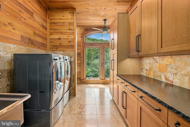 2042 Folk Rd, Fogelsville, PA 18051 - laundry room with wooden ceiling, washing machine and dryer, a ceiling fan, wood walls, and cabinet space
