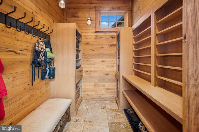 2042 Folk Rd, Fogelsville, PA 18051 - mudroom with wooden walls and stone tile floors