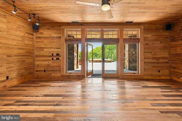 2042 Folk Rd, Fogelsville, PA 18051 - spare room featuring track lighting, wood ceiling, wooden walls, hardwood / wood-style flooring, and ceiling fan
