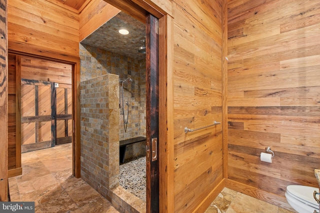 2042 Folk Rd, Fogelsville, PA 18051 - bathroom with toilet, walk in shower, wooden walls, and stone finish floors