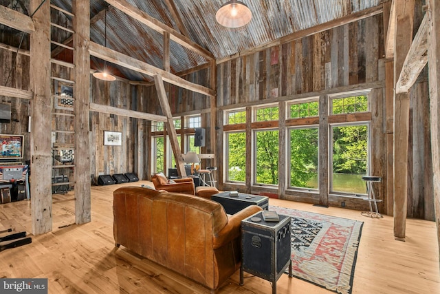 2042 Folk Rd, Fogelsville, PA 18051 - living area featuring high vaulted ceiling, wooden walls, and wood finished floors