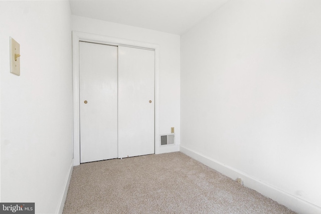 303 Coral St, Lancaster, PA 17603 - unfurnished bedroom featuring carpet, baseboards, and a closet