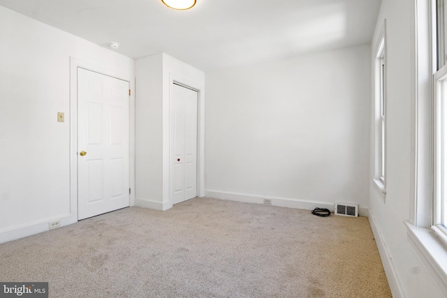 303 Coral St, Lancaster, PA 17603 - unfurnished bedroom with carpet flooring, baseboards, and a closet