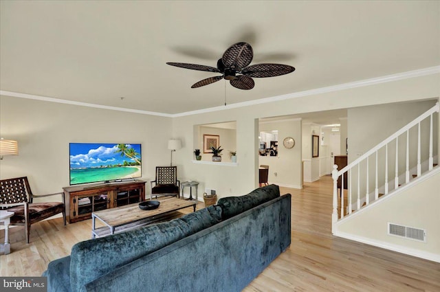 159 Waterford Ln, Reading, PA 19606 - living area with stairs, light wood-type flooring, ceiling fan, crown molding, and baseboards