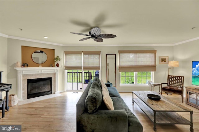 159 Waterford Ln, Reading, PA 19606 - living area featuring crown molding, wood finished floors, a ceiling fan, a high end fireplace, and baseboards