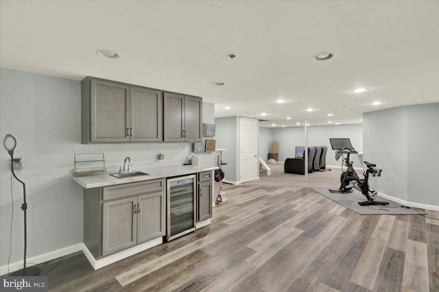 159 Waterford Ln, Reading, PA 19606 - kitchen with wine cooler, gray cabinets, a sink, baseboards, and recessed lighting