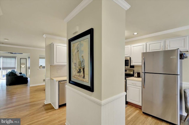 159 Waterford Ln, Reading, PA 19606 - hallway with light wood-style floors, ornamental molding, recessed lighting, and wainscoting