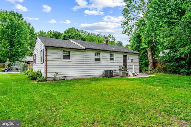 117 2nd Ave, Lindenwold, NJ 08021 - back of house featuring a yard, central air condition unit, a chimney, and a patio area