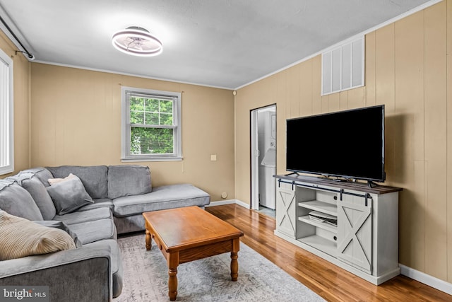 117 2nd Ave, Lindenwold, NJ 08021 - living room featuring light wood-style floors, crown molding, and baseboards