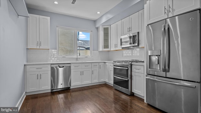 547 N 12th St Unit 2, Philadelphia, PA 19123 - kitchen with stainless steel appliances, light countertops, white cabinets, tasteful backsplash, and recessed lighting