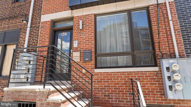 547 N 12th St Unit 2, Philadelphia, PA 19123 - doorway to property featuring brick siding