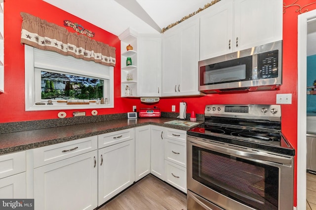 343 Mill Farm Trl, Berkeley Springs, WV 25411 - kitchen with appliances with stainless steel finishes, white cabinets, open shelves, dark countertops, and lofted ceiling