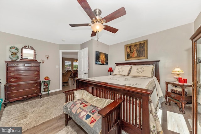 343 Mill Farm Trl, Berkeley Springs, WV 25411 - bedroom featuring wood finished floors, a ceiling fan, and baseboards