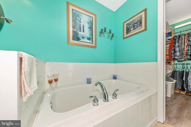 343 Mill Farm Trl, Berkeley Springs, WV 25411 - full bath with a garden tub, a spacious closet, and wood finished floors