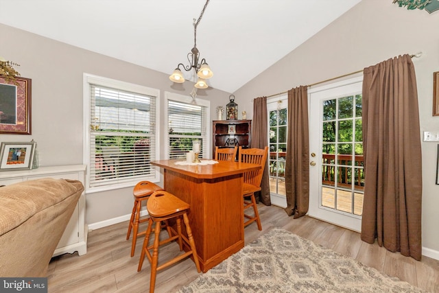 343 Mill Farm Trl, Berkeley Springs, WV 25411 - dining space with a chandelier, lofted ceiling, light wood-style floors, and healthy amount of natural light
