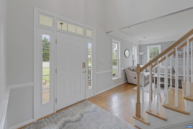 989 Clearfields Ln, Crozet, VA 22932 - entrance foyer with wood finished floors, crown molding, stairway, and baseboards