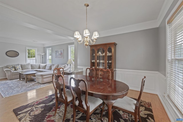 989 Clearfields Ln, Crozet, VA 22932 - dining room with a chandelier, wood finished floors, crown molding, and a wainscoted wall
