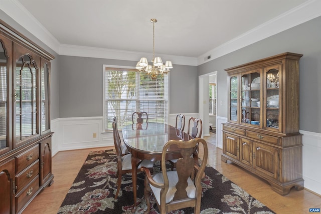 989 Clearfields Ln, Crozet, VA 22932 - dining space featuring healthy amount of natural light, a chandelier, wainscoting, light wood finished floors, and ornamental molding