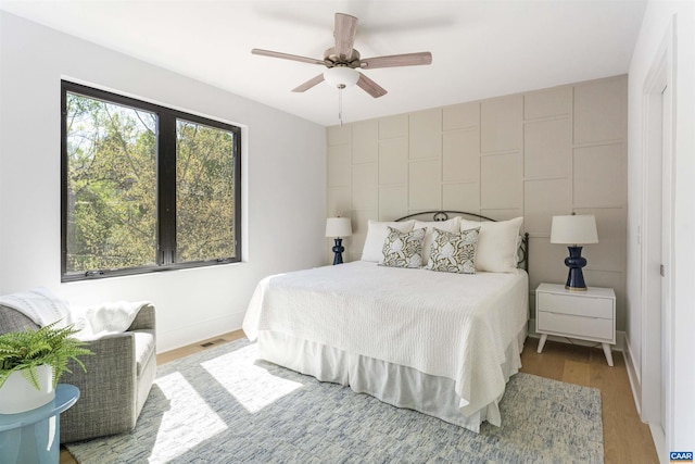 983 5th St SW, Charlottesville, VA 22902 - bedroom featuring light wood-style flooring, a ceiling fan, and baseboards