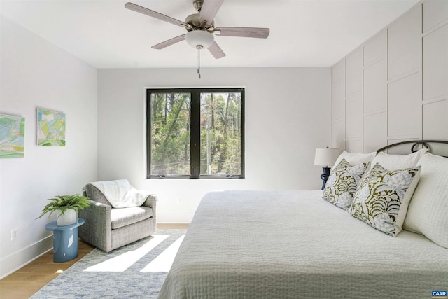 983 5th St SW, Charlottesville, VA 22902 - bedroom with wood finished floors, baseboards, and ceiling fan