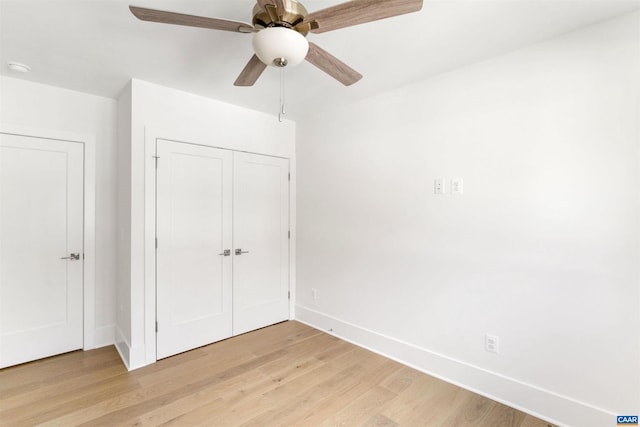 983 5th St SW, Charlottesville, VA 22902 - unfurnished bedroom featuring baseboards, light wood-style flooring, a closet, and ceiling fan