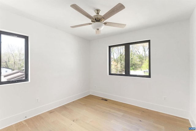 983 5th St SW, Charlottesville, VA 22902 - unfurnished room with baseboards, light wood-type flooring, and a ceiling fan