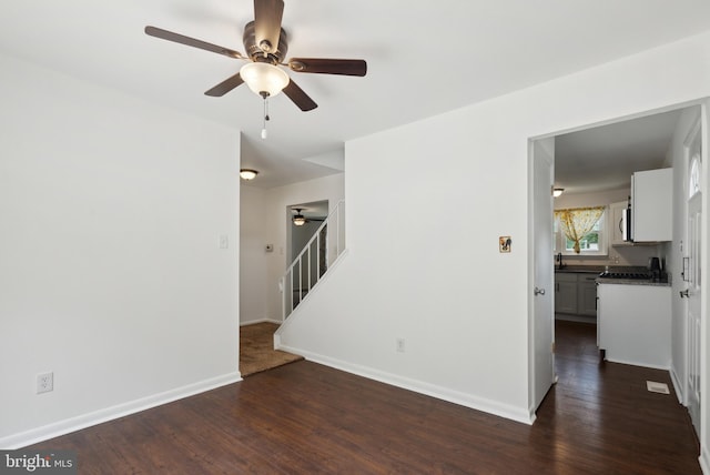 7 Breckenridge Dr, Sicklerville, NJ 08081 - unfurnished room with a ceiling fan, stairs, dark wood-style flooring, and baseboards