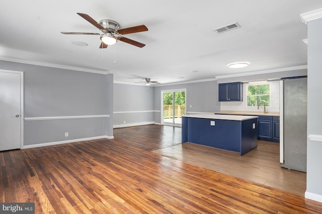 220 Firetower Rd, Port Deposit, MD 21904 - kitchen with blue cabinets, freestanding refrigerator, a ceiling fan, crown molding, and light countertops