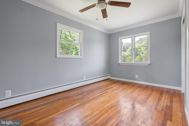 220 Firetower Rd, Port Deposit, MD 21904 - spare room with baseboard heating, hardwood / wood-style flooring, crown molding, a ceiling fan, and baseboards