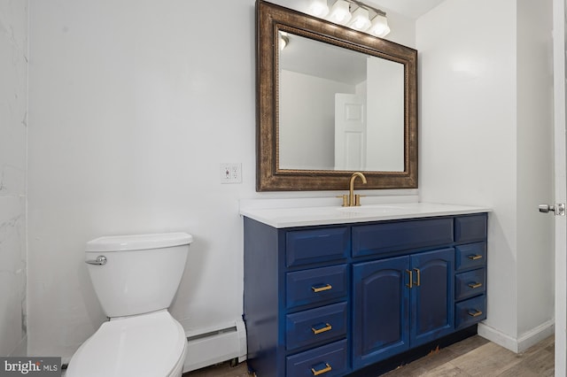 220 Firetower Rd, Port Deposit, MD 21904 - bathroom with a baseboard heating unit, vanity, toilet, wood finished floors, and baseboards