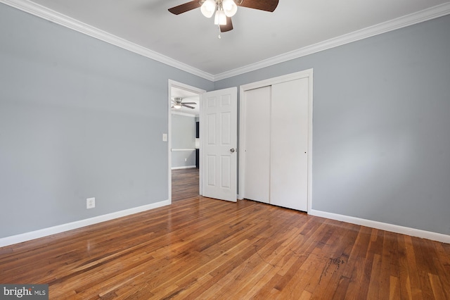 220 Firetower Rd, Port Deposit, MD 21904 - unfurnished bedroom featuring crown molding, baseboards, a closet, and hardwood / wood-style flooring