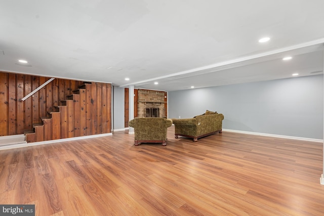 220 Firetower Rd, Port Deposit, MD 21904 - unfurnished room featuring wood finished floors, stairway, recessed lighting, a fireplace, and baseboards