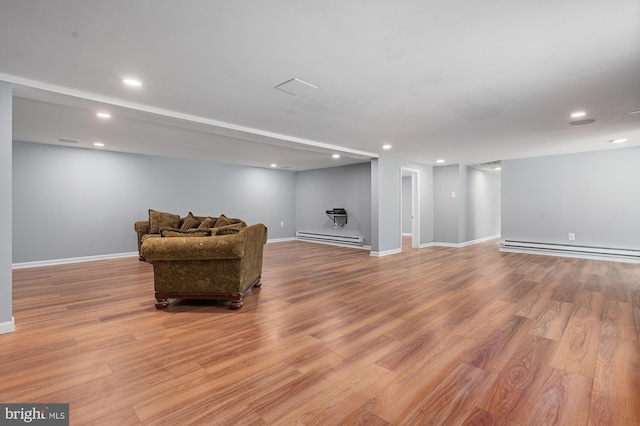 220 Firetower Rd, Port Deposit, MD 21904 - living area with a baseboard heating unit, light wood-style floors, baseboards, and recessed lighting