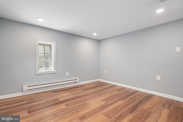 220 Firetower Rd, Port Deposit, MD 21904 - unfurnished room featuring a baseboard heating unit, wood finished floors, baseboards, and recessed lighting