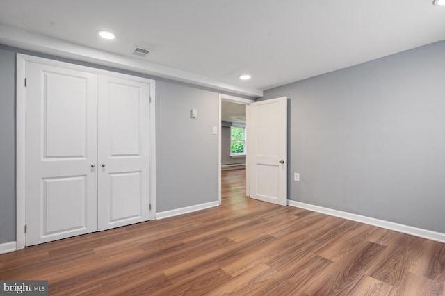 220 Firetower Rd, Port Deposit, MD 21904 - unfurnished bedroom with wood finished floors, baseboards, recessed lighting, a baseboard radiator, and a closet