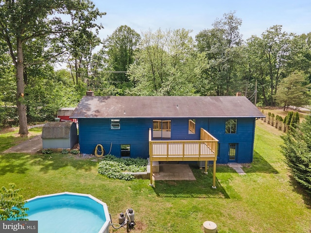 220 Firetower Rd, Port Deposit, MD 21904 - rear view of house with a deck, a yard, an outdoor pool, and a chimney
