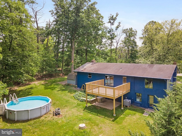 220 Firetower Rd, Port Deposit, MD 21904 - back of house with central AC unit, a chimney, a deck, an outdoor pool, and a yard