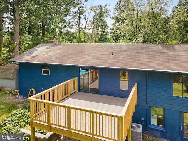 220 Firetower Rd, Port Deposit, MD 21904 - rear view of house featuring central AC, a deck, a shingled roof, a chimney, and view of scattered trees
