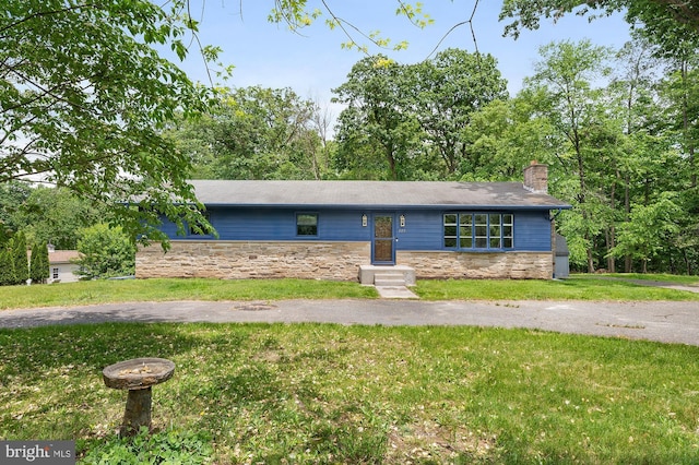 220 Firetower Rd, Port Deposit, MD 21904 - mid-century inspired home with stone siding, a front yard, and a chimney