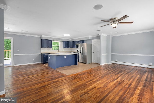 220 Firetower Rd, Port Deposit, MD 21904 - kitchen with stainless steel fridge, blue cabinetry, wood finished floors, a ceiling fan, and ornamental molding